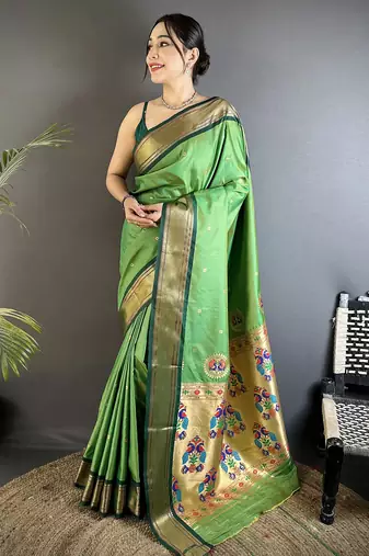 Women green peacock ethnic motifs lichi silk saree