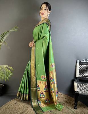 Women green peacock ethnic motifs lichi silk blend saree 2