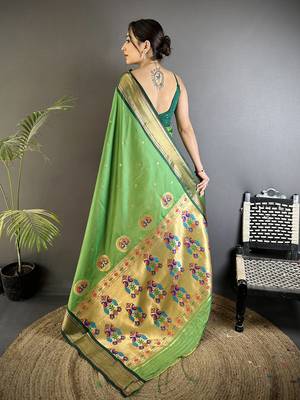 Women green peacock ethnic motifs lichi silk blend saree 3