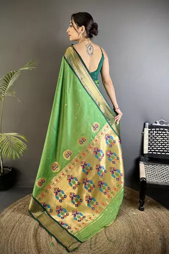 Women green peacock ethnic motifs lichi silk saree