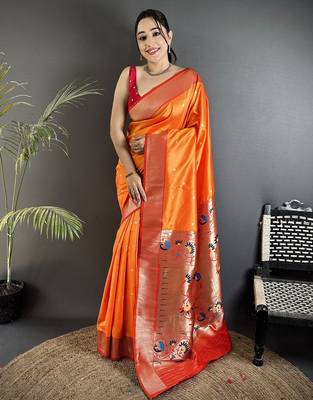 Women orange peacock motifs lichi silk blend saree 1