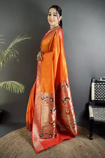 Women orange peacock motifs lichi silk saree