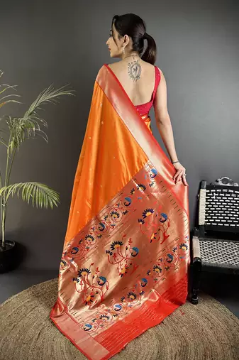 Women orange peacock motifs lichi silk saree