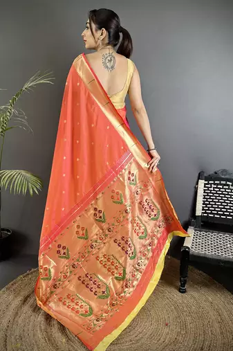 Women orange floral ikkat motifs lichi silk saree