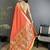 Women orange floral ikkat motifs lichi silk saree