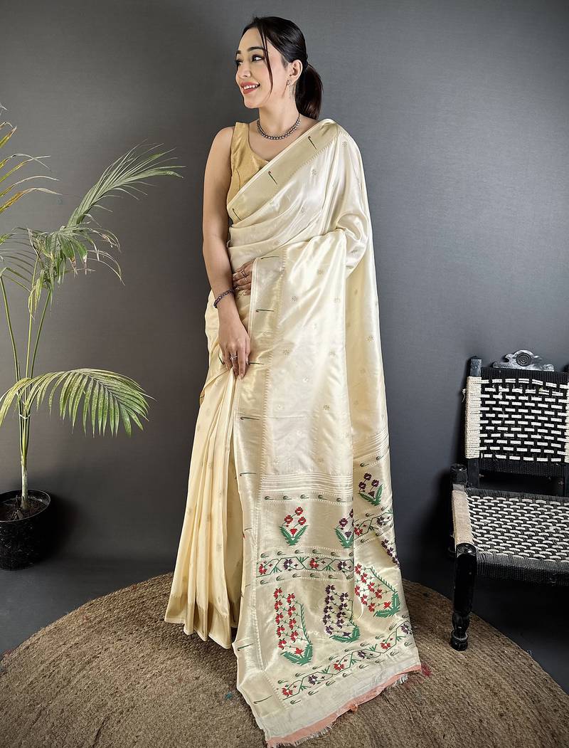 Women cream floral ikkat motifs lichi silk saree