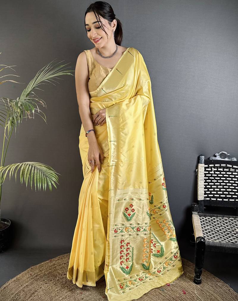 Women light yellow floral ikkat motifs lichi silk saree