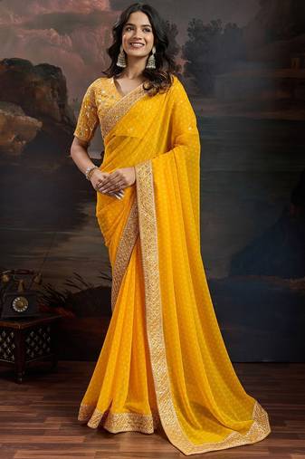 Women rangoli yellow zari lace work saree