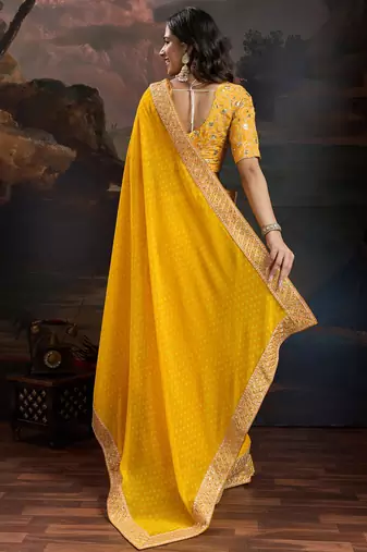 Women rangoli yellow zari lace work saree