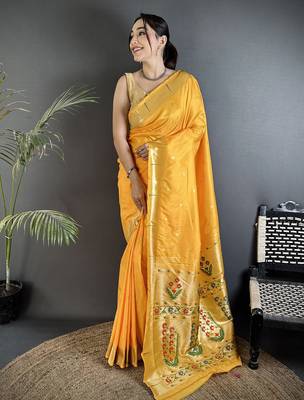 Women yellow floral ikkat motifs lichi silk blend saree 1