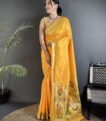 Women yellow floral ikkat motifs lichi silk blend saree