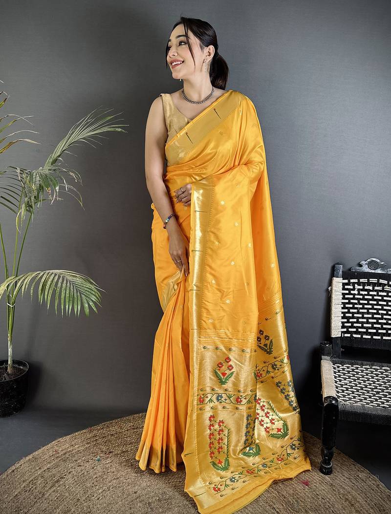 Women yellow floral ikkat motifs lichi silk saree