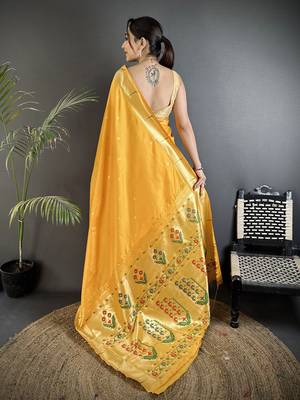 Women yellow floral ikkat motifs lichi silk blend saree 3