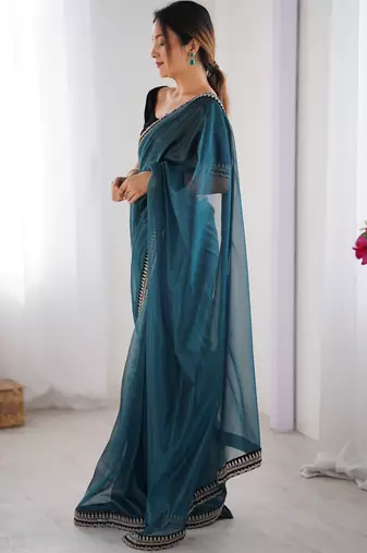 Women net teal zari lace work saree