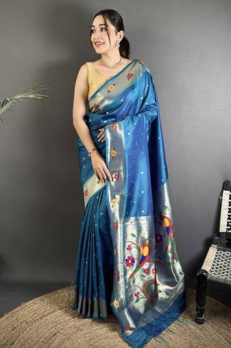 Women teal blue parrot & floral woven design lichi silk saree