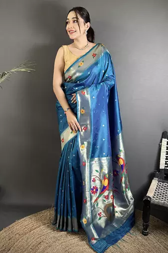 Women teal blue parrot & floral woven design lichi silk saree