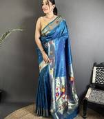 Women teal blue parrot & floral woven design lichi silk saree