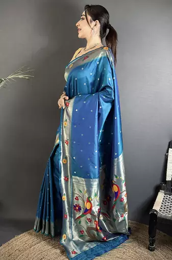 Women teal blue parrot & floral woven design lichi silk saree