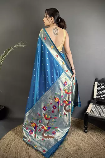 Women teal blue parrot & floral woven design lichi silk saree