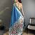 Women teal blue parrot & floral woven design lichi silk saree