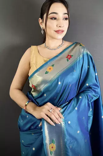 Women teal blue parrot & floral woven design lichi silk saree