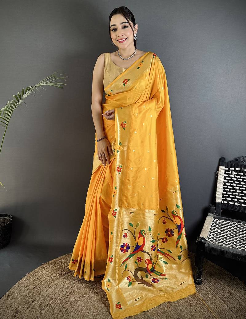 Women yellow parrot & floral woven design lichi silk saree