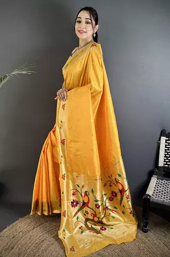Women yellow parrot & floral woven design lichi silk saree