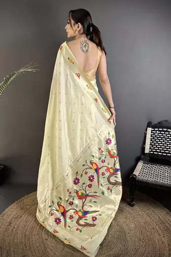 Women cream parrot & floral woven design lichi silk saree