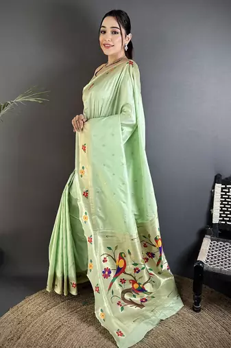 Women mint green parrot & floral woven design lichi silk saree