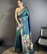 Women teal parrot & floral woven design lichi silk saree