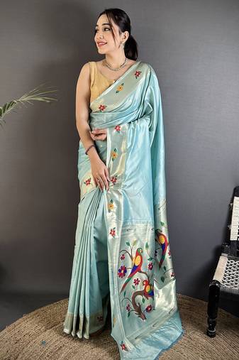Women sky blue parrot & floral woven design lichi silk saree