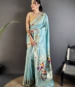 Women sky blue parrot & floral woven design lichi silk saree