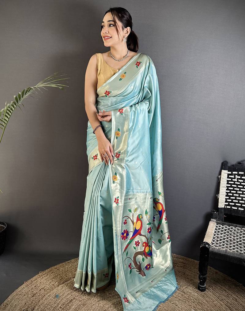 Women sky blue parrot & floral woven design lichi silk saree