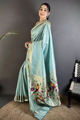 Women sky blue parrot & floral woven design lichi silk saree