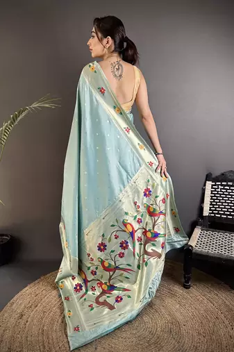 Women sky blue parrot & floral woven design lichi silk saree