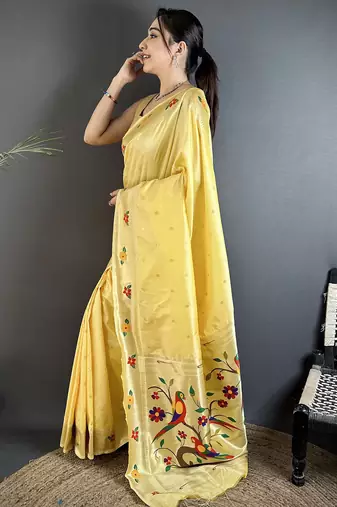 Women light yellow parrot & floral woven design lichi silk saree