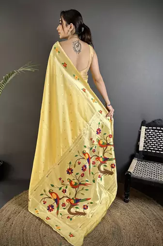 Women light yellow parrot & floral woven design lichi silk saree