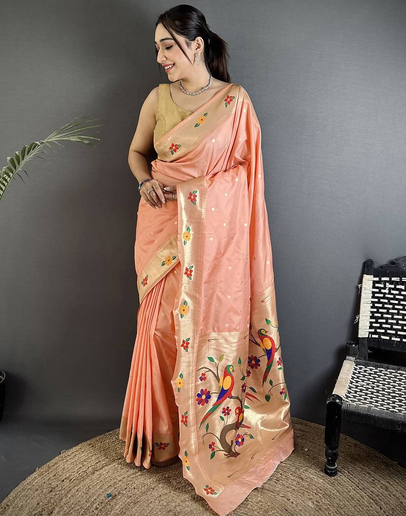 Women peach parrot & floral woven design lichi silk saree