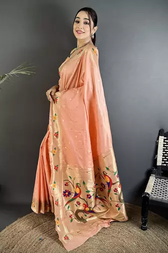 Women peach parrot & floral woven design lichi silk saree