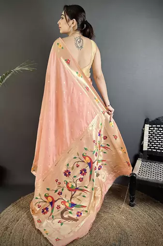 Women peach parrot & floral woven design lichi silk saree