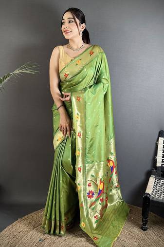 Women green parrot & floral woven design lichi silk saree
