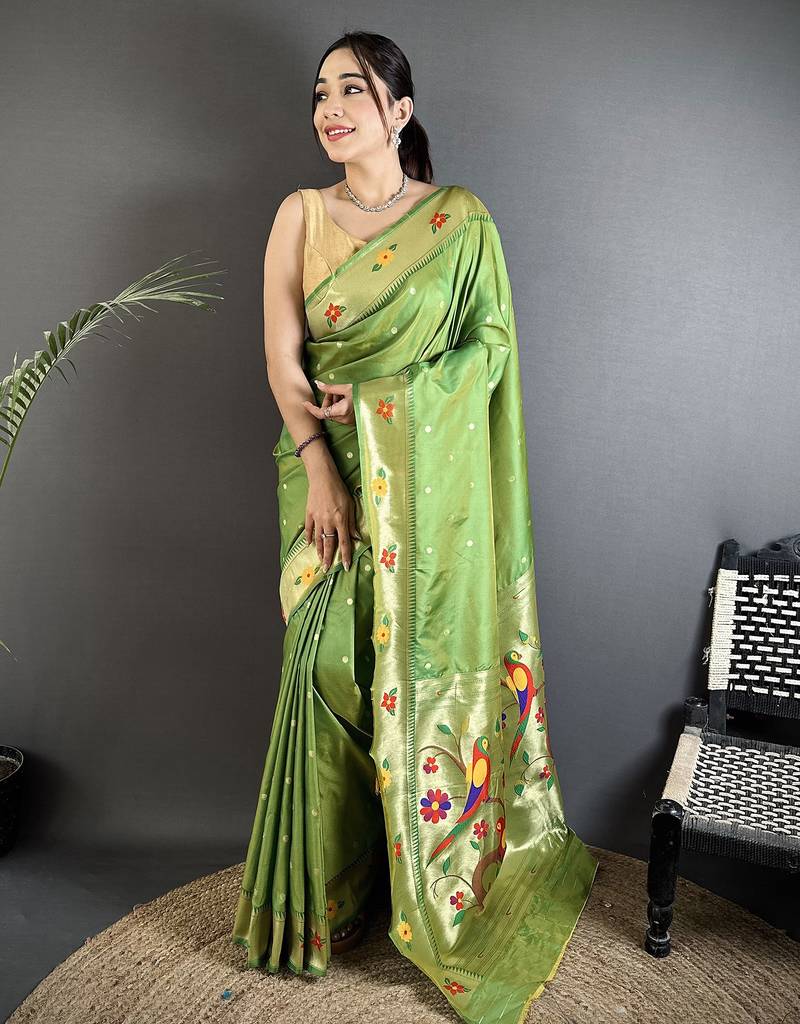 Women green parrot & floral woven design lichi silk saree
