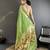 Women green parrot & floral woven design lichi silk saree