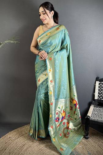 Women aqua blue parrot & floral woven design lichi silk saree