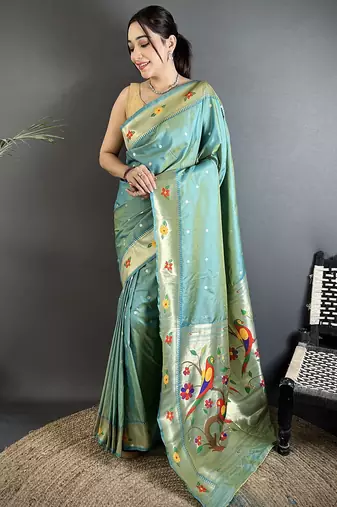 Women aqua blue parrot & floral woven design lichi silk saree