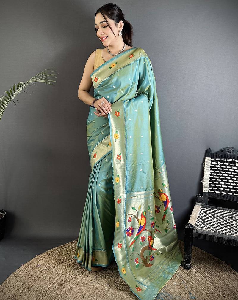 Women aqua blue parrot & floral woven design lichi silk saree
