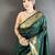Women dark green parrot & floral woven design lichi silk saree
