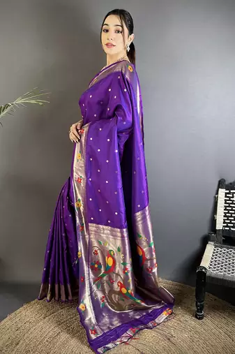 Women purple parrot & floral woven design lichi silk saree