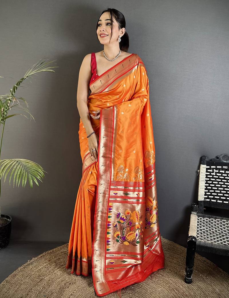 Women orange   floral motifs lichi silk saree
