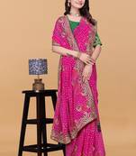 Women gorgette pink zari lace work saree